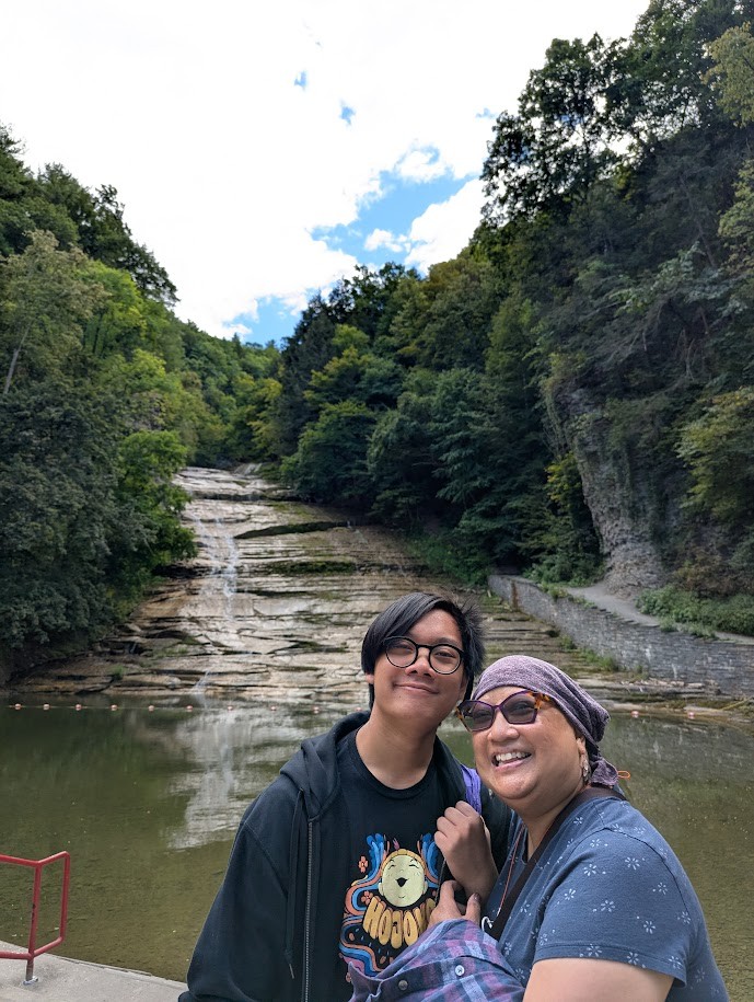 Zenia Dacio-Mesina with her son beside a gorge